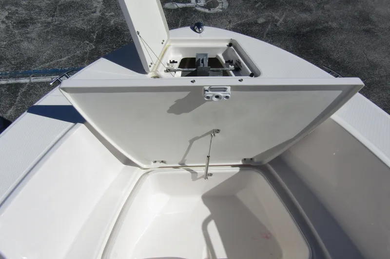 Slide: The Image of 2019 Robalo R180 Center Console boat storage compartment open on deck. - 8