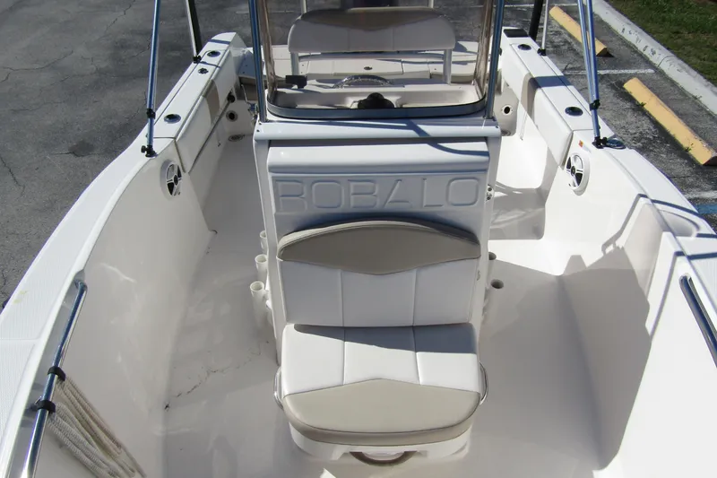 Slide: The Image of 2019 Robalo R180 Center Console boat interior with seating and console view. - 9