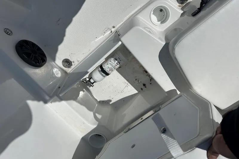 Slide: The Image of Interior view of a 2025 Tahoe T18 boat, featuring seating and storage compartments. - 7