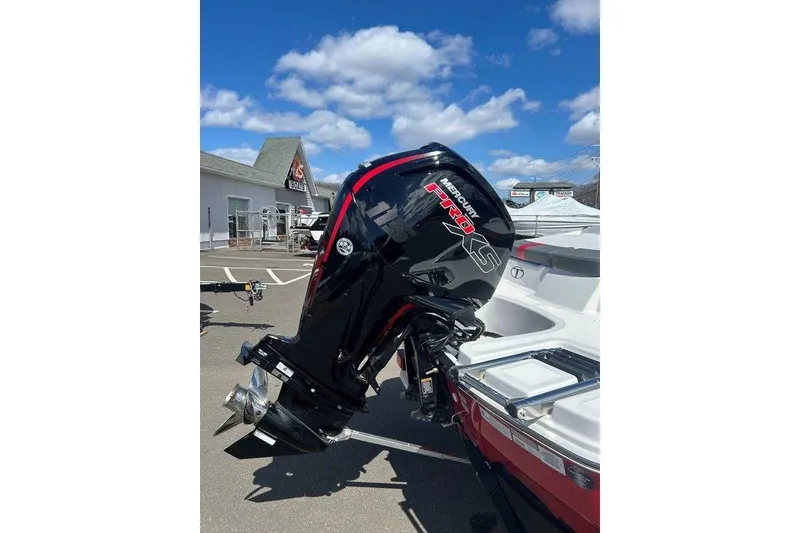 Slide: The Image of 2025 Tahoe T18 boat with Mercury Pro XS outboard motor under a clear blue sky. - 9