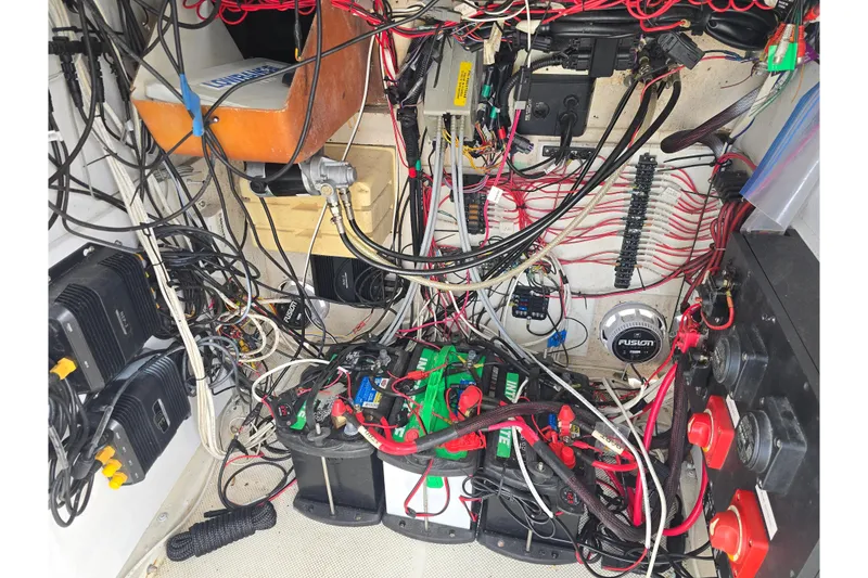 Slide: The Image of Electrical wiring and components inside a 2002 Sport-Craft Seacat 255 boat. - 20
