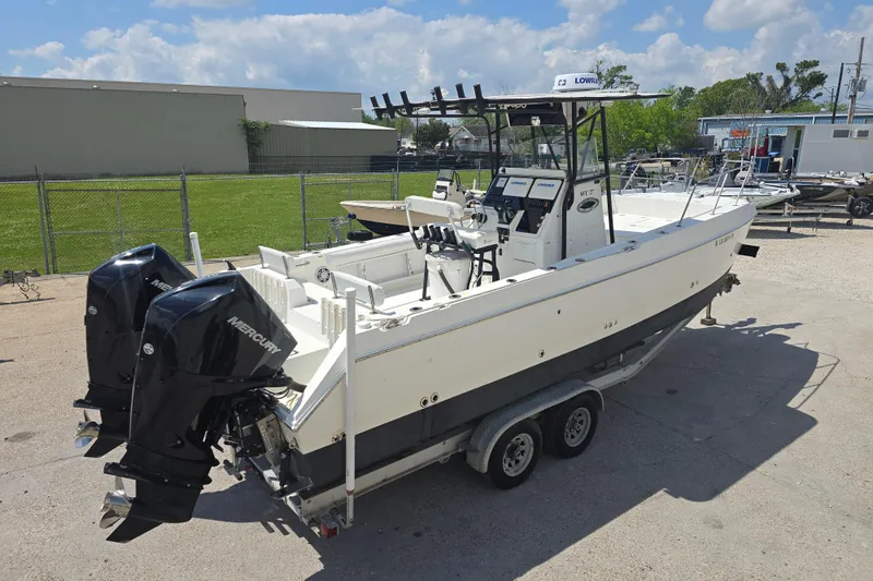 Slide: The Image of 2002 Sport-Craft Seacat 255 boat with dual Mercury engines on a trailer. - 29