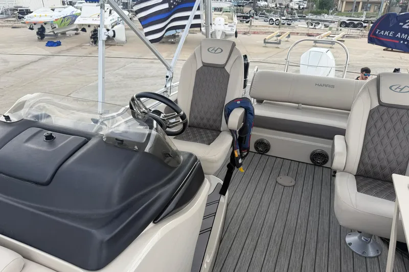 Slide: The Image of 2022 Harris FloteBote Solstice 250 interior with steering wheel and seating. - 13