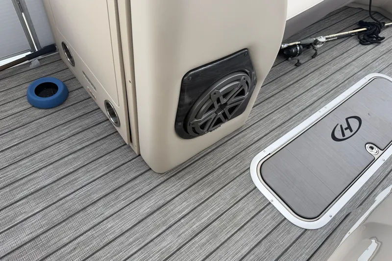 Slide: The Image of 2022 Harris FloteBote Solstice 250 deck with speaker and storage compartment. - 19