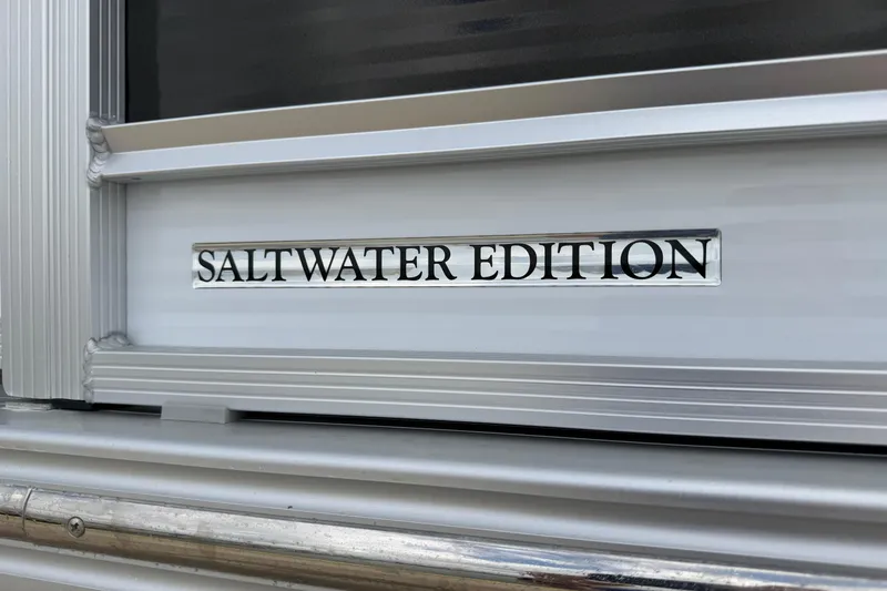 Slide: The Image of 2022 Harris FloteBote Solstice 250, Saltwater Edition badge detail. - 6