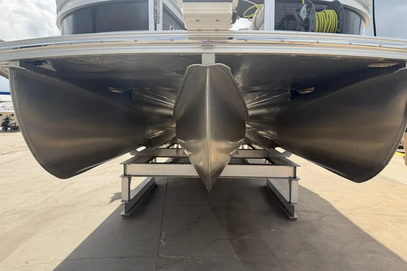 Slide: The Image of 2022 Harris FloteBote Solstice 250 pontoon boat on a trailer, viewed from below. - 8