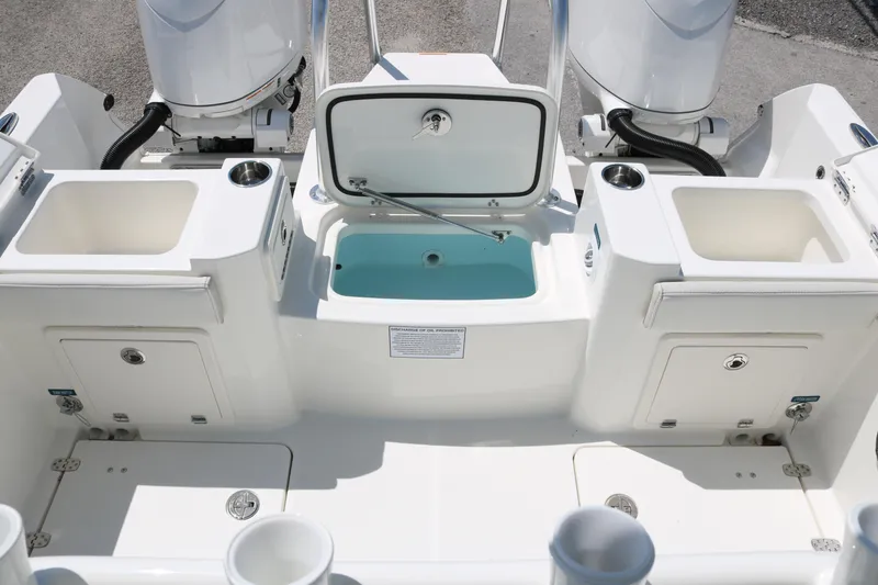 Slide: The Image of 2026 World Cat 235 TE boat deck with storage compartments and livewell. - 17