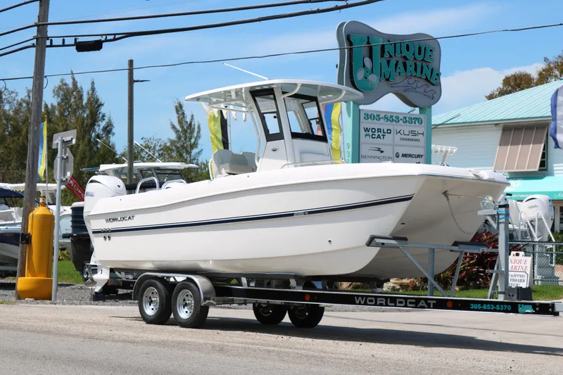 Slide: The Image of 2026 World Cat 235 TE boat on trailer at Unique Marine dealership. - 3