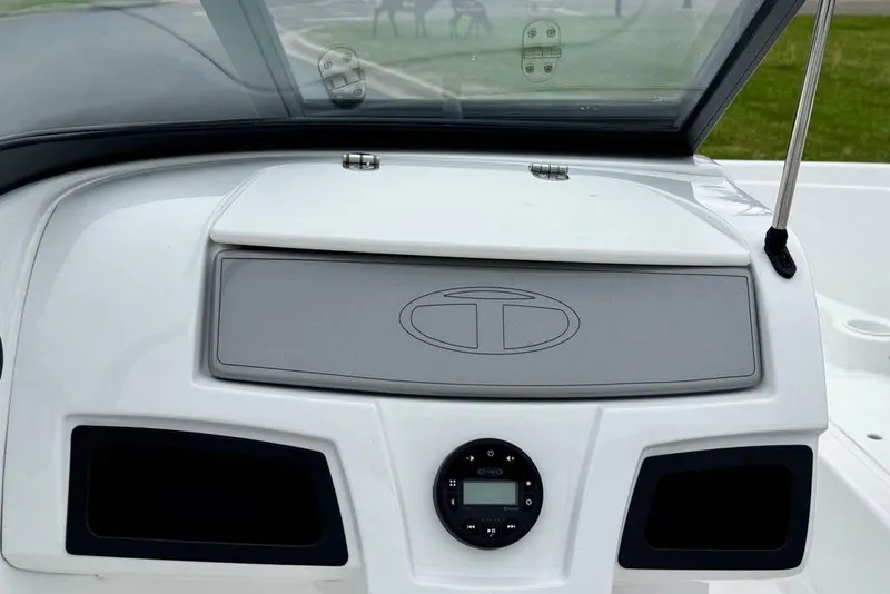 Slide: The Image of Dashboard of a 2020 Tahoe 450 TF boat with control panel and logo. - 10