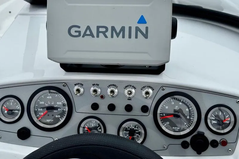 Slide: The Image of Dashboard of a 2020 Tahoe 450 TF boat with Garmin navigation system. - 2