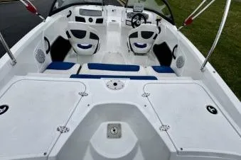 Slide: The Image of 2020 Tahoe 450 TF boat interior with seating and steering wheel. - 8
