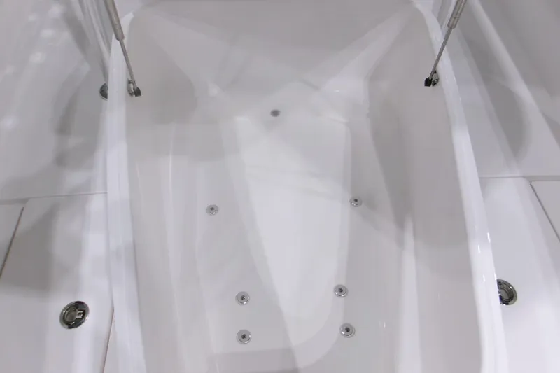 Slide: The Image of Contender 32 ST 2026 boat interior, featuring sleek white design and modern fittings. - 14