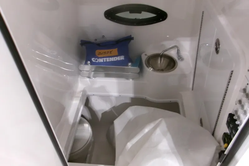 Slide: The Image of Interior of 2026 Contender 32 ST boat featuring sink and storage area. - 16