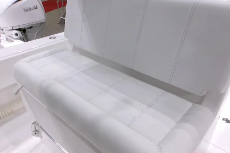 Slide: The Image of White seating on 2026 Contender 32 ST boat with Yamaha engine in background. - 17