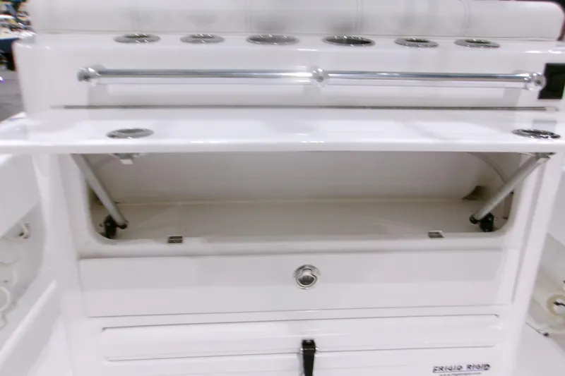 Slide: The Image of 2026 Contender 32 ST boat storage compartment with stainless steel rod holders. - 18
