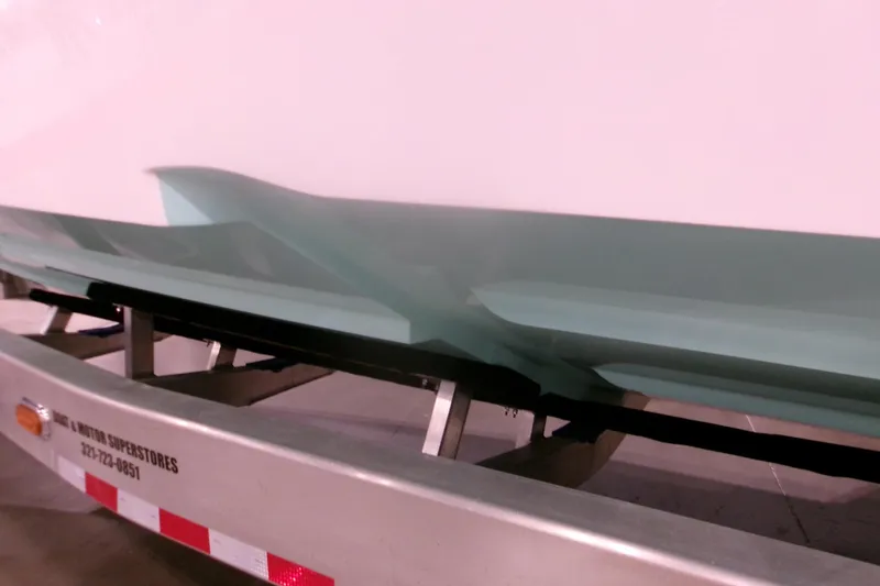 Slide: The Image of 2026 Contender 32 ST boat hull on trailer, showcasing sleek design and craftsmanship. - 22