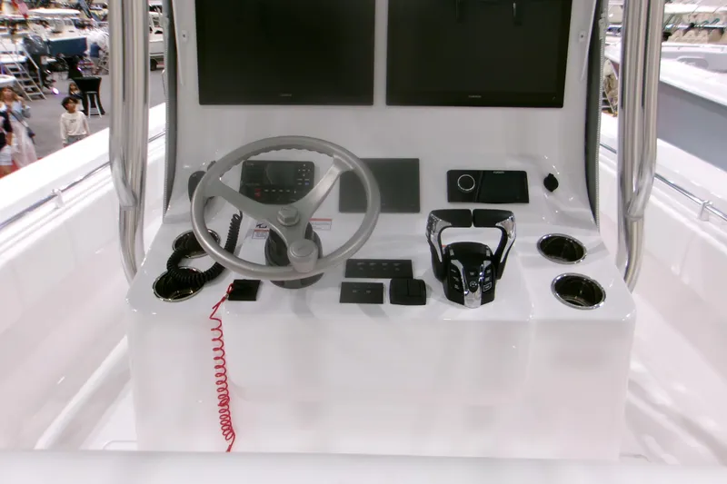 Slide: The Image of 2026 Contender 32 ST boat console with steering wheel and electronic controls. - 5