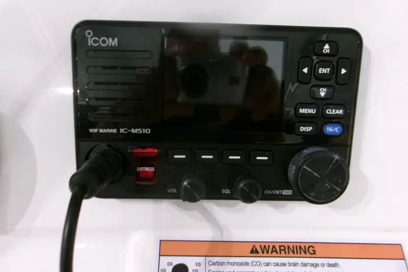 Slide: The Image of Icom VHF Marine IC-M510 radio on 2026 Contender 32 ST boat dashboard. - 7