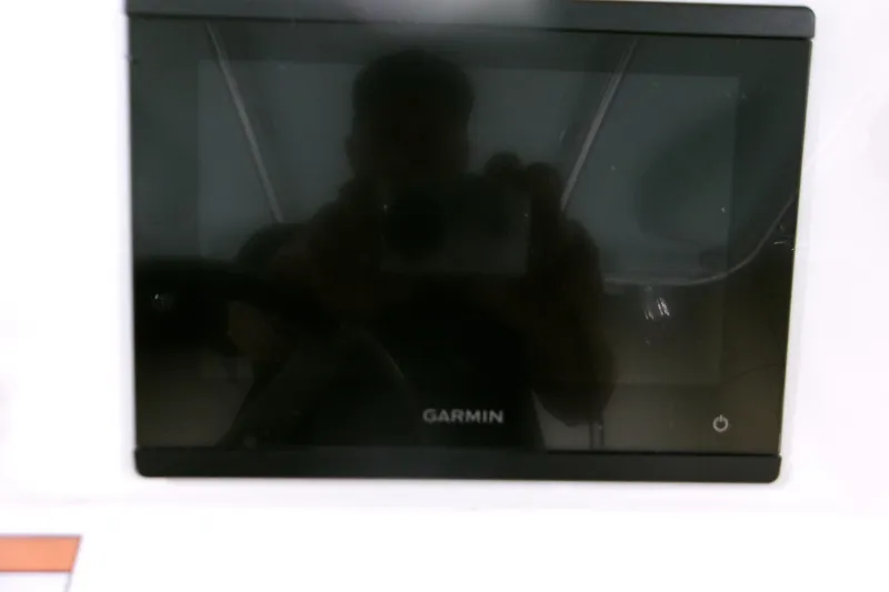 Slide: The Image of Garmin display on 2026 Contender 32 ST boat dashboard. - 8