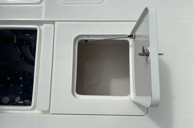 Slide: The Image of Open storage compartment on a 2018 SeaVee 390Z boat deck. - 16