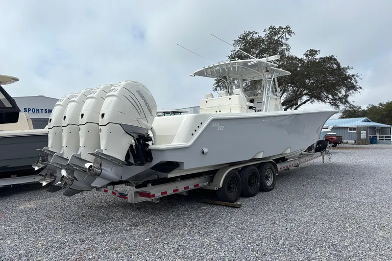 Slide: The Image of 2018 SeaVee 390Z boat with quad outboard engines on a trailer. - 2