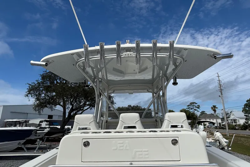 Slide: The Image of 2018 SeaVee 390Z boat with T-top and rod holders under a clear blue sky. - 20