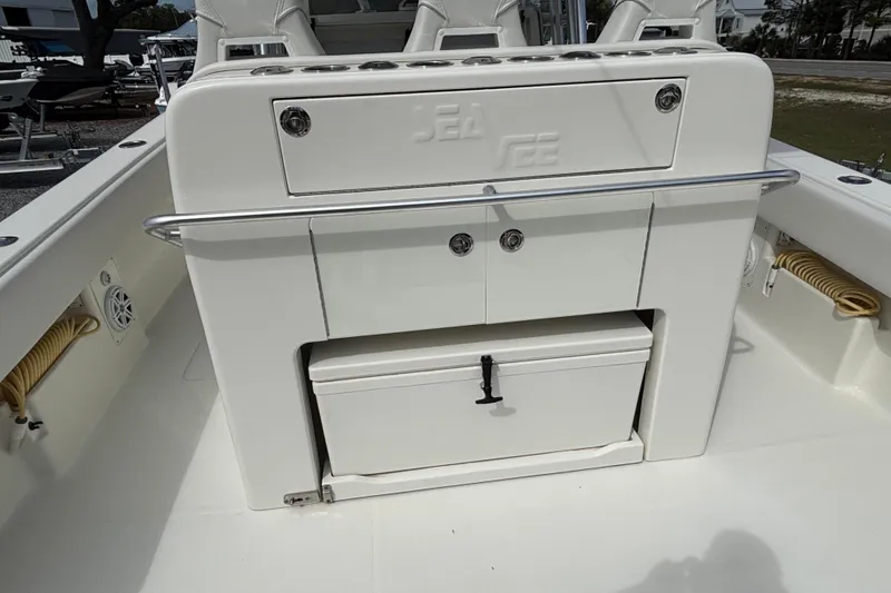 Slide: The Image of 2018 SeaVee 390Z boat console with storage compartments and cooler. - 21