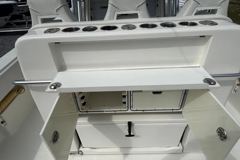 Slide: The Image of 2018 SeaVee 390Z boat interior with storage compartments and cup holders. - 22