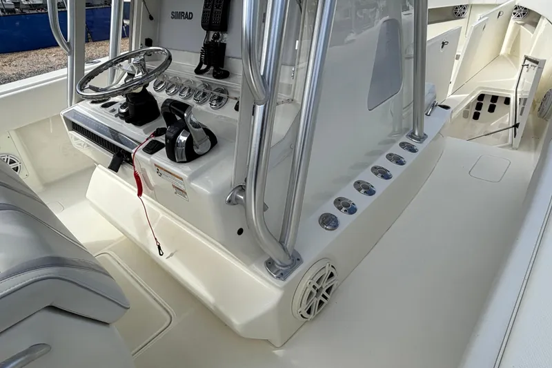 Slide: The Image of 2018 SeaVee 390Z boat cockpit with steering wheel and control panel. - 23