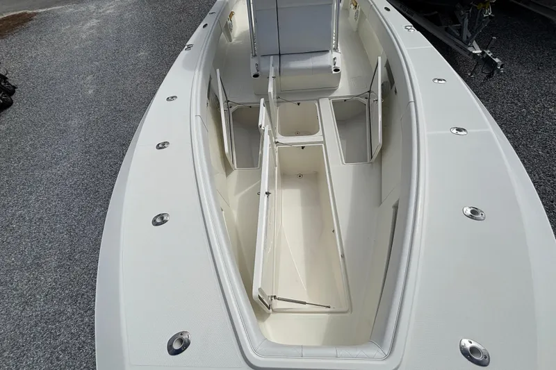 Slide: The Image of 2018 SeaVee 390Z boat interior with open storage compartments and seating area. - 24
