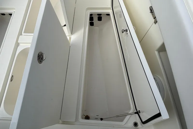 Slide: The Image of Open storage compartments on a 2018 SeaVee 390Z boat, showcasing spacious interior design. - 25
