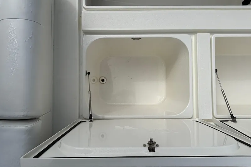 Slide: The Image of 2018 SeaVee 390Z boat storage compartments with open lids, showcasing interior space. - 26