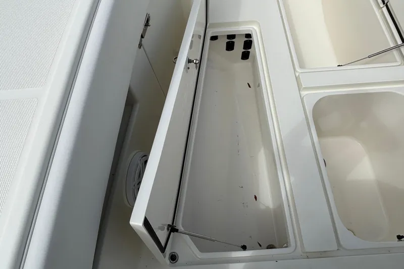 Slide: The Image of Open storage compartment on a 2018 SeaVee 390Z boat deck. - 27