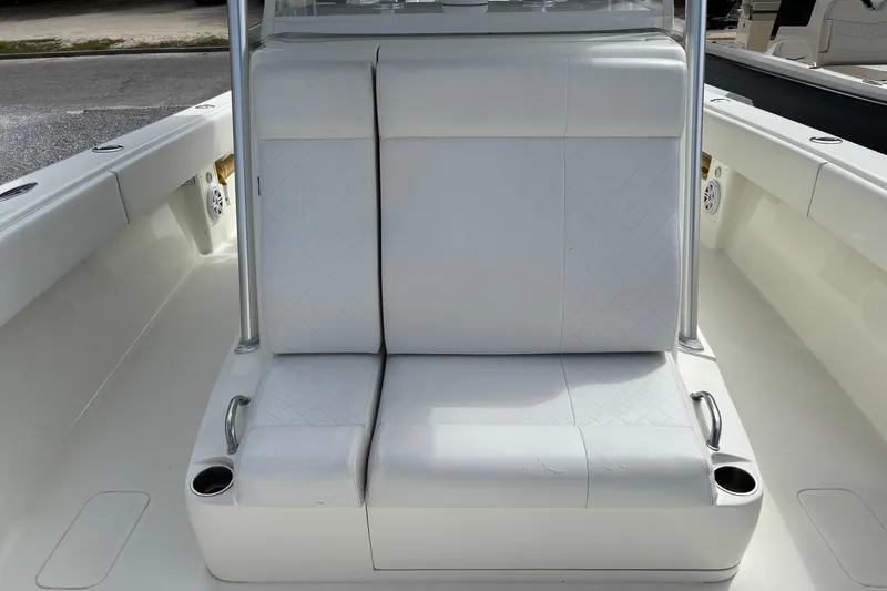 Slide: The Image of 2018 SeaVee 390Z boat with white cushioned seating and cup holders. - 34
