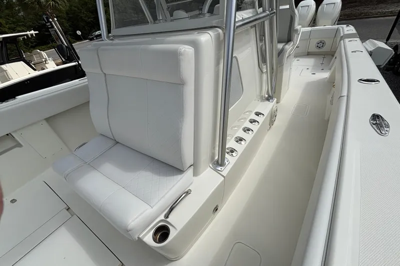 Slide: The Image of 2018 SeaVee 390Z boat interior with white seating and stainless steel accents. - 35
