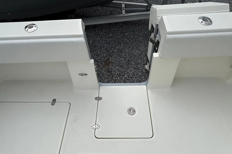 Slide: The Image of 2018 SeaVee 390Z boat deck with storage compartments and rod holders. - 39