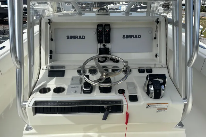 Slide: The Image of 2018 SeaVee 390Z boat console with Simrad electronics and steering wheel. - 5
