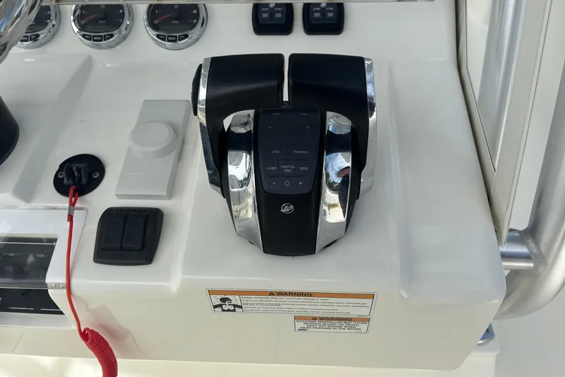 Slide: The Image of Control panel of a 2018 SeaVee 390Z boat with throttle and gauges. - 6