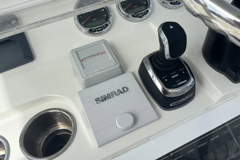 Slide: The Image of Control panel of a 2018 SeaVee 390Z boat featuring Simrad and Optimus EPS systems. - 8