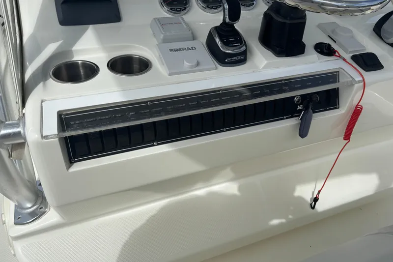 Slide: The Image of Control panel of a 2018 SeaVee 390Z boat with navigation and engine controls. - 9