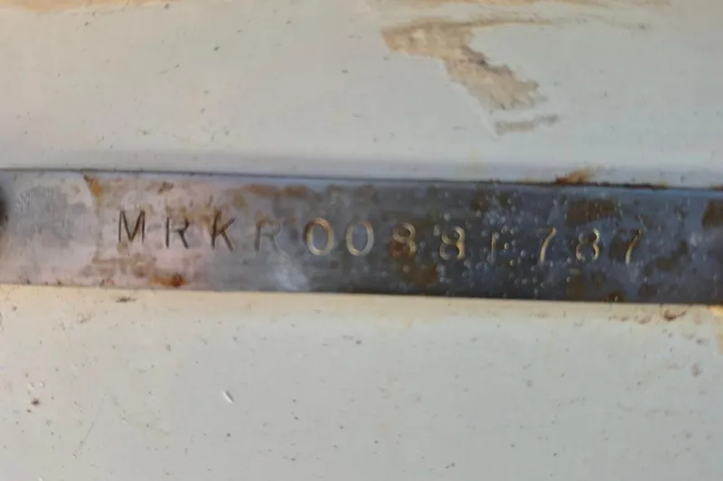 Slide: The Image of Hull identification number on 1987 Mako 261 Center Console boat. - 11