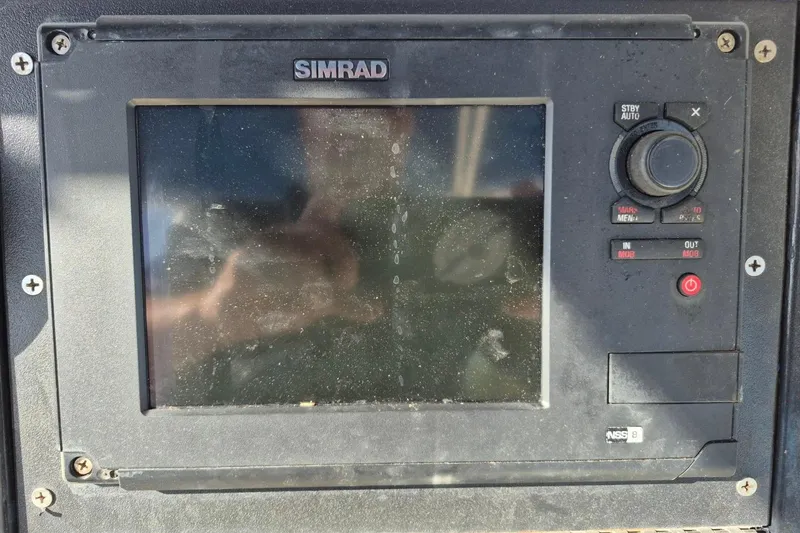 Slide: The Image of Simrad marine navigation system on 1987 Mako 261 Center Console boat. - 19