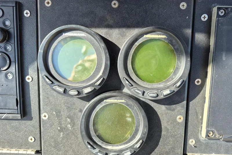 Slide: The Image of Close-up of 1987 Mako 261 Center Console dashboard with three round gauges. - 20