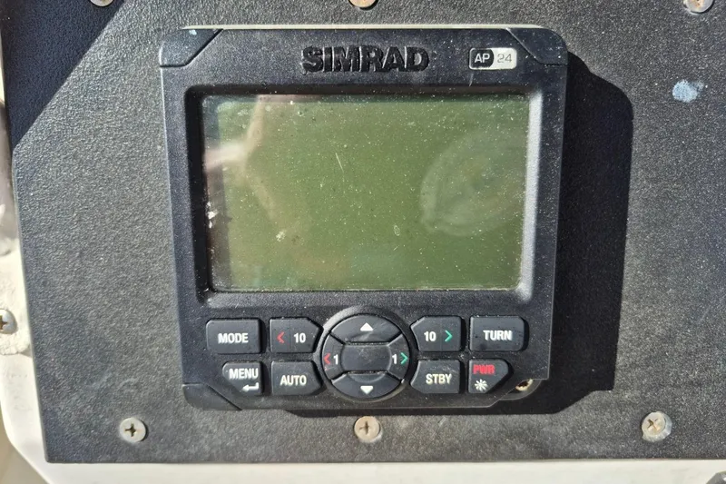 Slide: The Image of Simrad AP24 autopilot display on 1987 Mako 261 Center Console boat. - 21