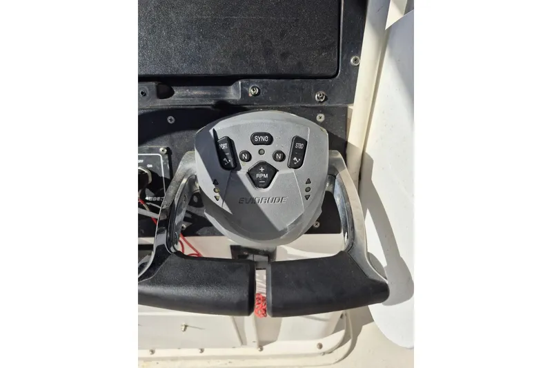 Slide: The Image of Close-up of Evinrude boat throttle control on 1987 Mako 261 Center Console. - 23