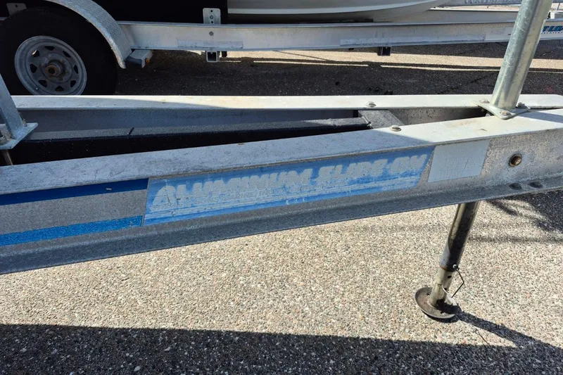 Slide: The Image of Trailer for 1987 Mako 261 Center Console boat, featuring aluminum slide-on design. - 47