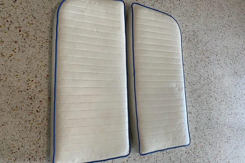 Slide: The Image of White boat cushions with blue trim for 1987 Mako 261 Center Console. - 49