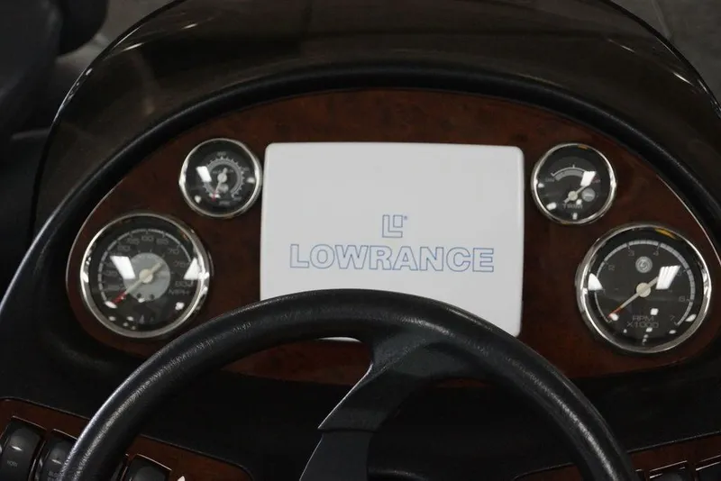 Slide: The Image of Dashboard of a 2006 Ranger 521 VX boat featuring Lowrance electronics. - 14