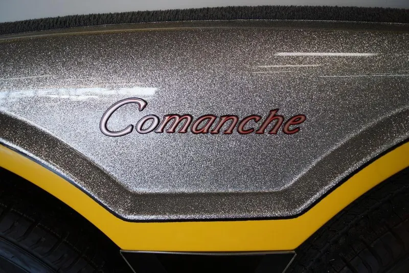 Slide: The Image of 2006 Ranger 521 VX Comanche boat with metallic finish and yellow trim. - 16