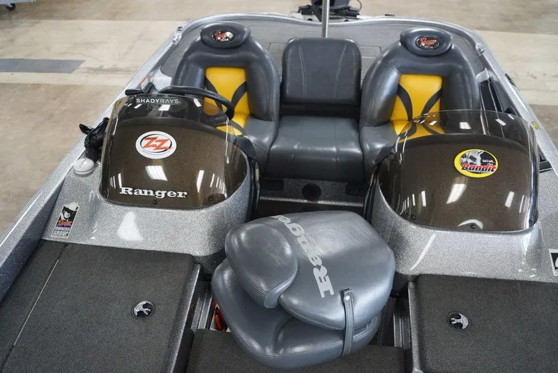 Slide: The Image of 2006 Ranger 521 VX boat interior with dual seats and branded windshields. - 5